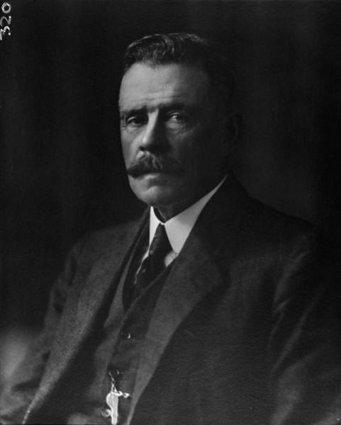Studio portrait of middle aged man in three piece suit circa 1914.