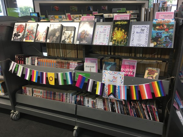 Bookshelf with Pride flag bunting