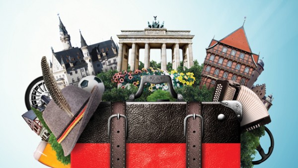 German flag bag with German buildings, landmarks, and cultural items coming out of it.