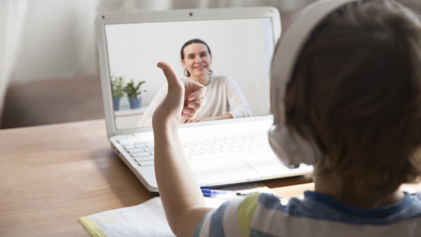 Child on video call with Librarian